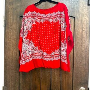 Worn once. Soft flowy material balloons at the bottom. Looks great with jeans